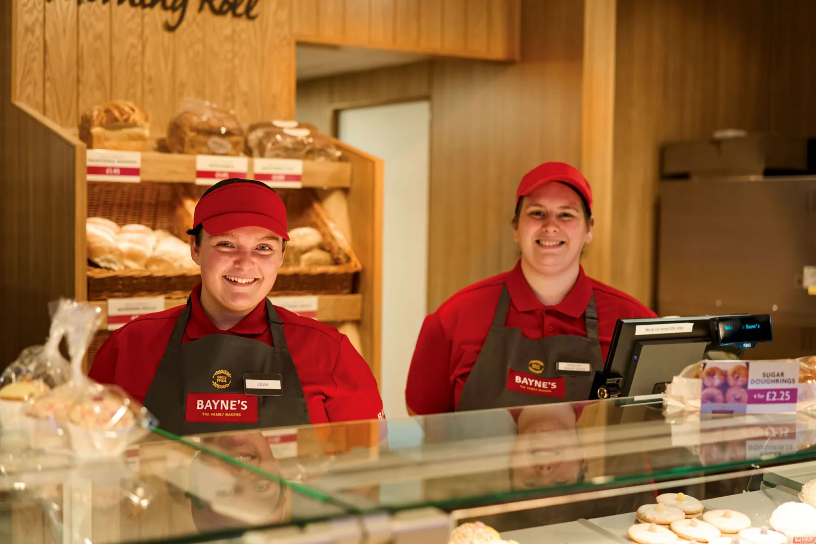 Bayne’s shop colleagues behind the counter